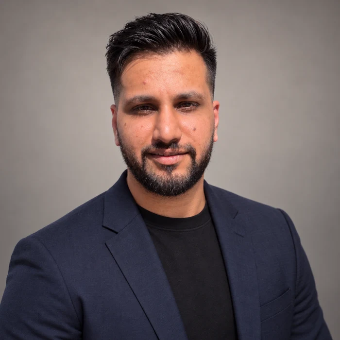 Professional portrait of Shivam Sahdev wearing a navy blazer